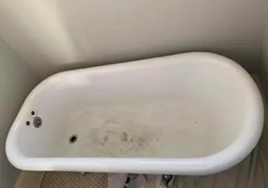 Before bathtub refinishing showing smooth and glossy surface