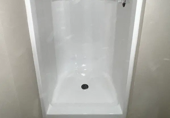  After shower reglazing showing restored shine and smooth surface