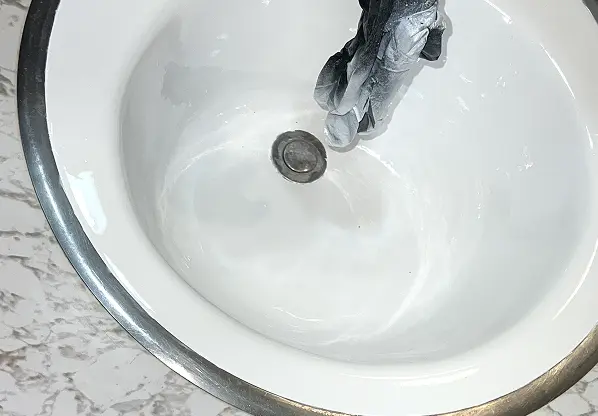 After comparison of sink reglazing showing flawless transformation