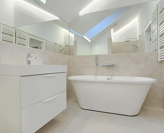 Modern bathroom with freshly reglazed bathtub and tiles