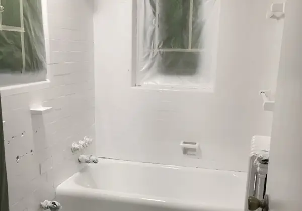 After bathroom reglazing showing restored shine and surfaces