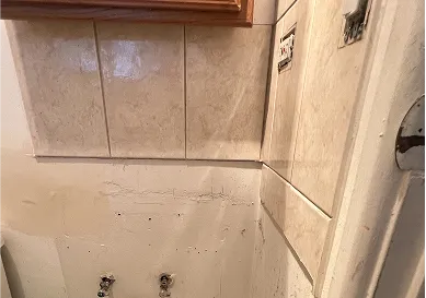 Before tile reglazing displaying chipped surface and discoloration