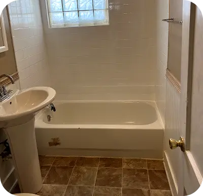 Refinished pedestal sink restored to elegant shine