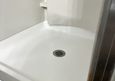 After shower reglazing revealing bright polished tiles with fresh finish