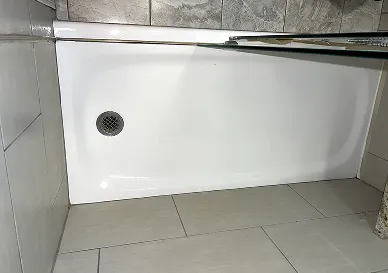 After shower reglazing with clean modern tile surface