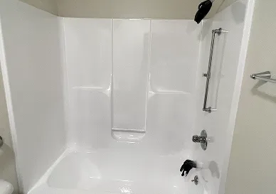 After shower restoration revealing bright polished tiles