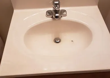 After sink restoration showcasing bright polished sink surface