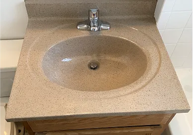 Before sink refinishing featuring scratches and dull finish
