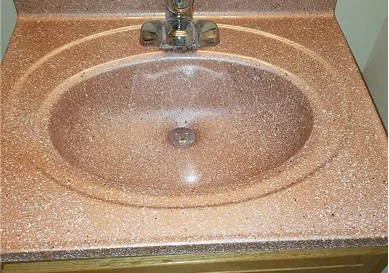 Before sink restoration with chipped edges and stains